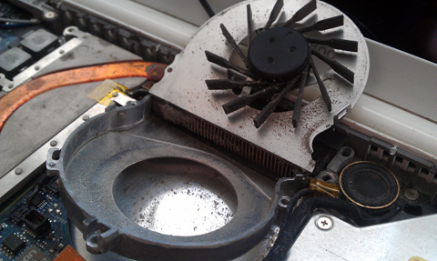 this is an image of a macbook fan that had been removed from a macbook and taken apart for cleaning because it was full of dust